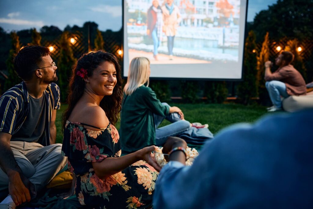 happy-woman-and-her-friends-eating-popcorn-during-2026-01-06-10-29-35-utc (1)